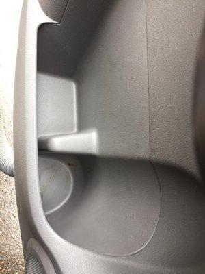 Cup holder in back seat. You can't see it so well but there's something smeared in there.