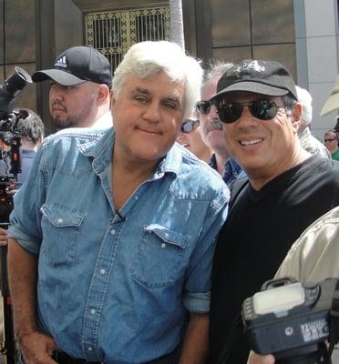 Car Enthusiasts Jay Leno and Dr. E. checking out the cars at the Concours d"Elegance car show in Beverly Hills