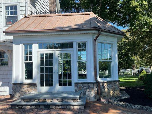 Standing seam accent roof in Aged Copper color