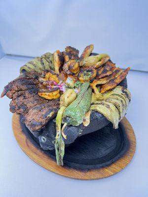 ELADIO'S MOLCAJETE.
A mix of tenders Steak, juicy shrimps, chicken, Mexican chorizo, Nopales, grilled onios, oaxacan cheese and jalapenos.