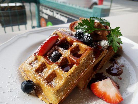 Whole wheat waffle with apple butter, pomegranate syrup and fruit