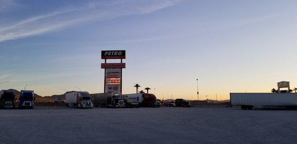 Gravel parking but there are many more paved spots in and around the fuel islands and store. If you don't mind a little dust, good parking.