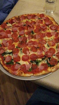 Spinach, pepperoni and Canadian bacon.  Very delicious.