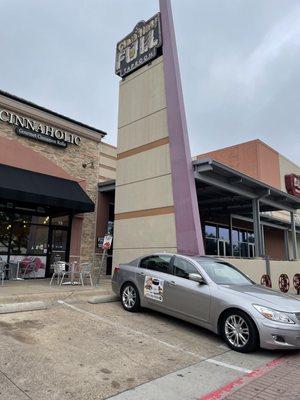 Cinnaholic is next door to Alamo Drafthouse.