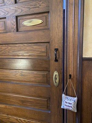 The rooms have these beautiful big wooden doors