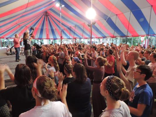 Teens worship under the Big Top during rally at the Lord's Boot Camp at Teen Missions International, Merritt Island, Florida.