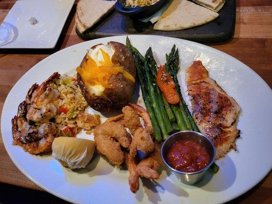 The Trio: grilled shrimp w/rice pilaf, fried shrimp w/house made cocktail sauce, & grilled salmon, loaded baked potato & fresh asparagus.