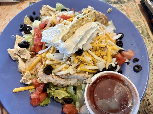 Taco salad half chicken and beef. Get the beef. And ask for side of French dressings overall it was ok