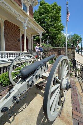 A restored Civil War cannon stands guard at the Sherman House Museum.