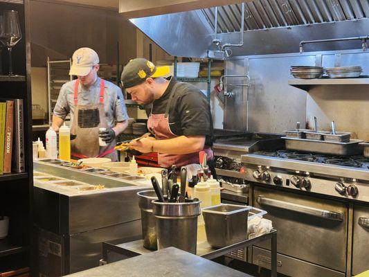 Watching chefs plate from the chefs counter