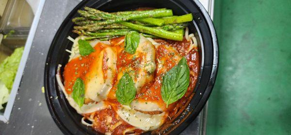 Eggplant Parmesan over Linguine pasta with Asparagus.