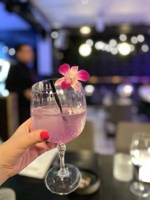 Cocktail with an orchid garnish