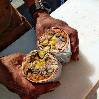 Cuban pork burrito with black beans and fried plantains.