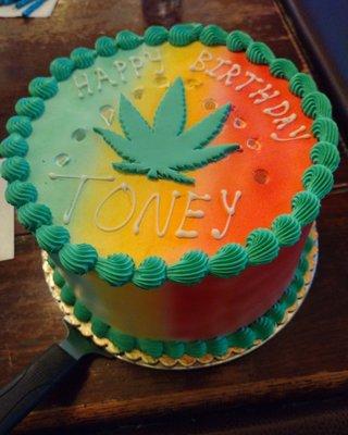 My custom cake. The birthday boy was born on 4/20 so that's why there is a pot leaf on the cake. It is Strawberry Shortcake.