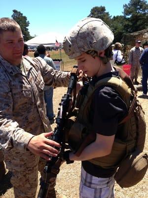 Trying on the military gear.