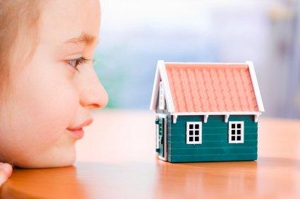 Girl looking at house.