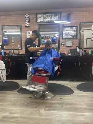 Bobo getting his hair cut for kindergarten.