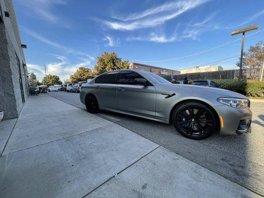 Bmw M5 ,customer wants a different look,so we remove the old tint and we install ceramic 5%on all windows .tail lights and windshield 40%