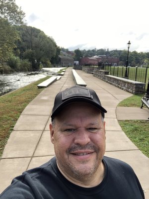 Nice river walk with a stream full of fish running through it