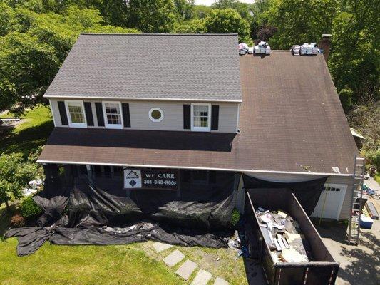 Mid way through our roof installation! Our Catch-All Landscape Protection System shows We Care!