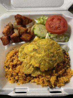 Fried pork, arroz con gandules, tostones, and salad