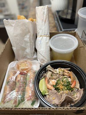 Spring rolls, Phnom Penh Noodles, BBQ Beef sandwich, and Cha Kwai (fried dough)