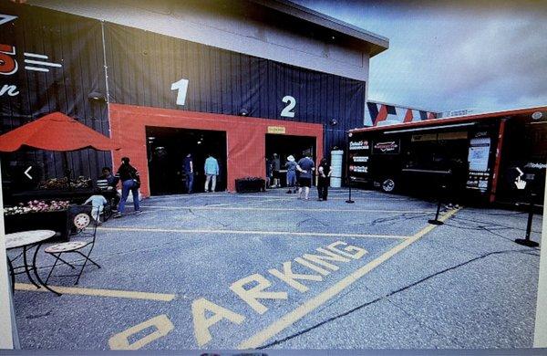 Outdoor patio, food truck and entrance to ordering area