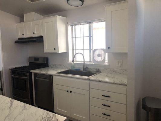 Kitchen cabinets, sink, dishwasher, faucet