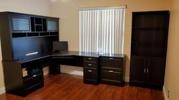 Office desk with hatch assmebly, storage shelfs closet assembly.