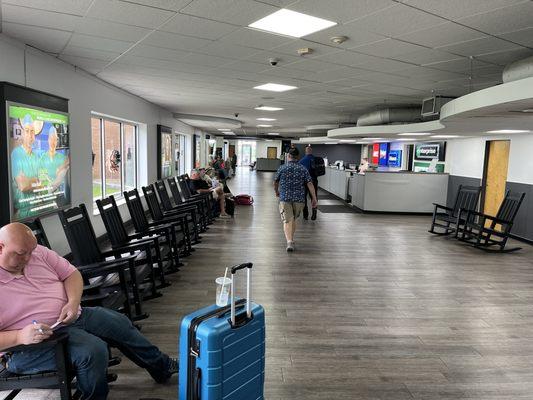 Heading to gate after relaxing in supplied rocking chairs in ticketing area.