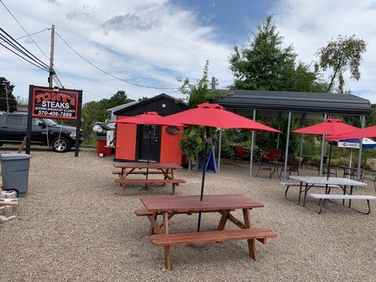 Outdoor seating and covered awning seating.