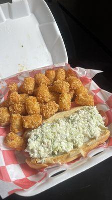 Hotdog added slaw and Tater Tots