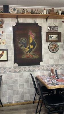 Wall picture of their many chicken decorations