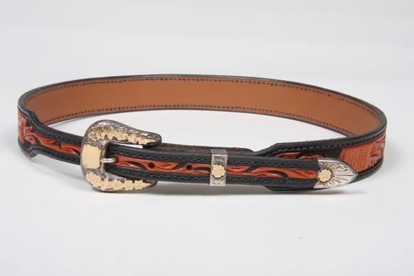 Hand carved/tooled western style belt with 3 piece sterling silver and gold buckle set.