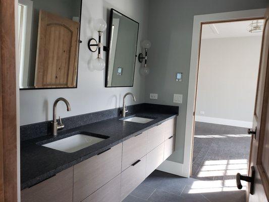 Jack and Jill bathroom. Plumbing and light fixtures by Reddington Designs