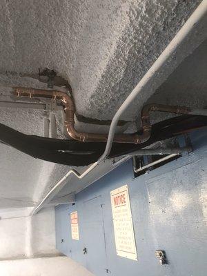 1" copper line repair at an apartment in garage area