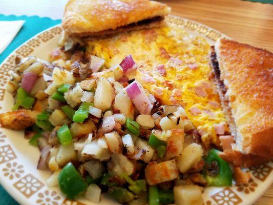 Ham and cheese omelet with homefries with peppers and onions