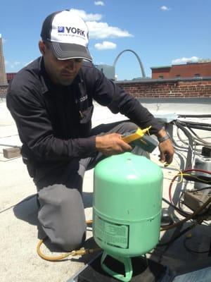 Bryant Bonano - Weighing in refrigerant after a condenser shut-off valve replacement.