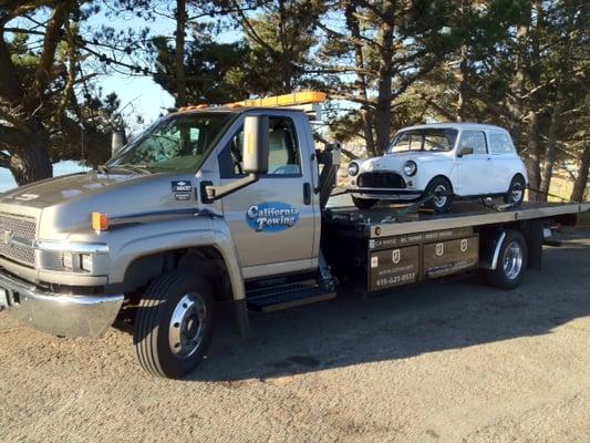 George at California Towing doing flatbed transportation for an Austin Mini.