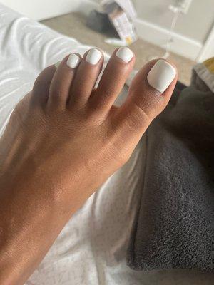 All white Pedicure with gel polish.