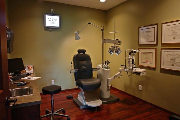 Modern exam room with digital chart system.