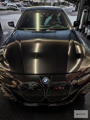 BMW i4 Black - Full Front STEK Paint Protection Film and 7-year Artdeshine Nano-Graphene Coating applied