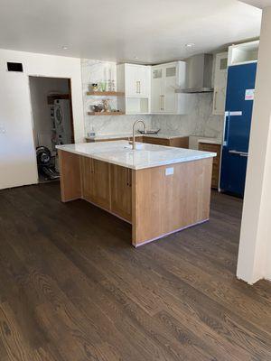 Stain applied to newly laid kitchen hardwood floor