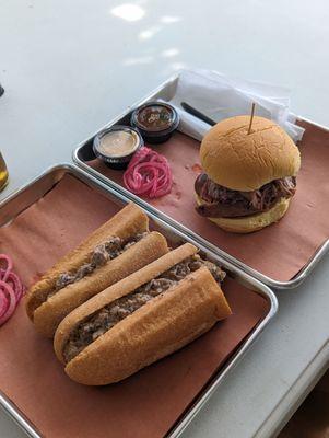 Brisket cheese steak on the left, sandwich with sausage, briskets etc