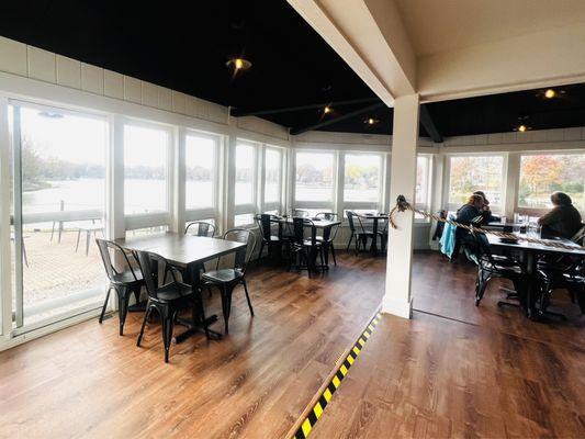 Big wide open windows with a view of Forrest Lake, modern clean rustic farm style.