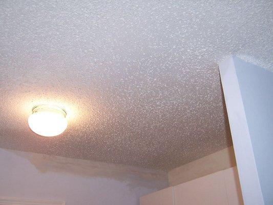 Applied a popcorn ceiling spray over newly installed sheetrock on ceiling to match existing texture throughout the home perfectly