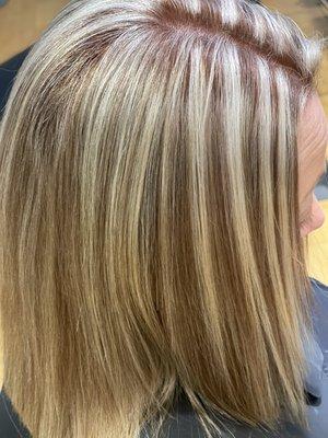 Chunky highlights with a color gloss for shine. Beautiful blunt haircut .