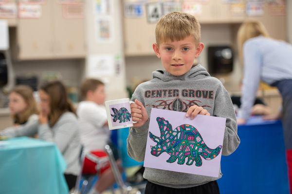 A student shares his artwork and the mug we created with it.