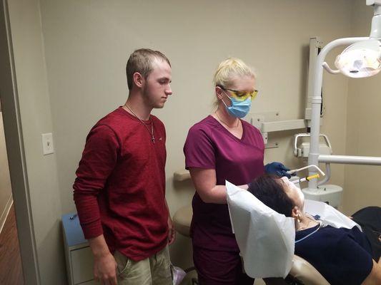 Career Shadow Day!
We enjoyed having this young man hang out with us for a day and learn about what we do.

Future dentist????
Let's hope.