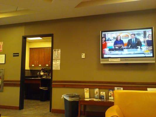 Nice waiting room with coffee and a TV